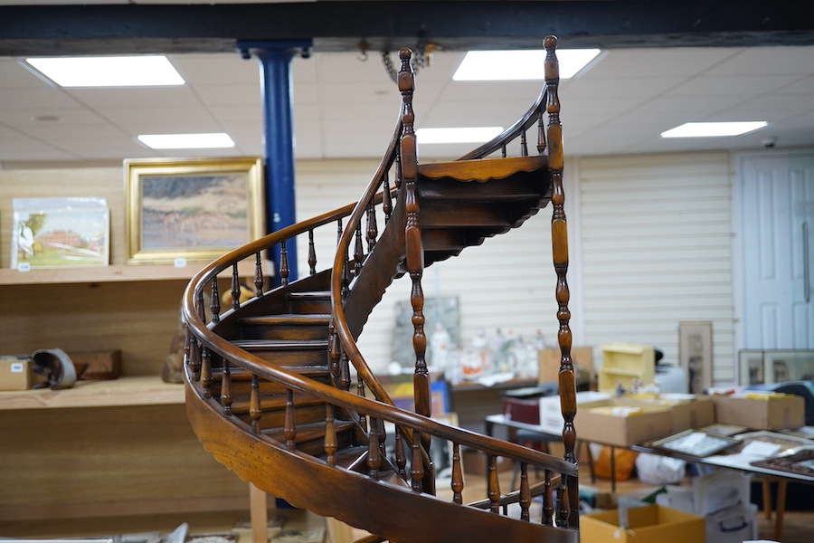 A scale model hardwood spiral staircase, 106cm tall. Condition - good